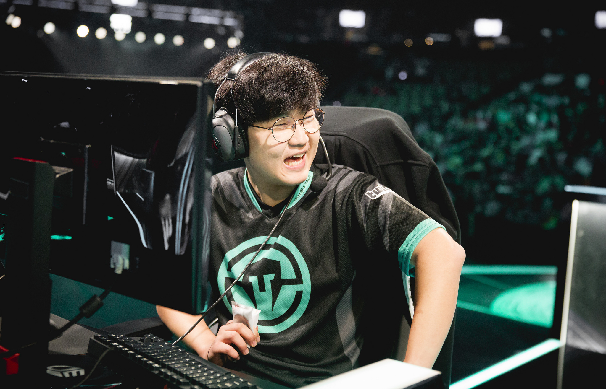 IMT Huni enjoying a laugh on stage. 