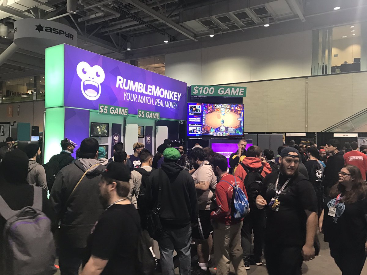 RumbleMonkey's booth at PAX East attracted visitors with a bright display of neon lights and a giant monkey head. Image via @AlexNSouter on Twitter.