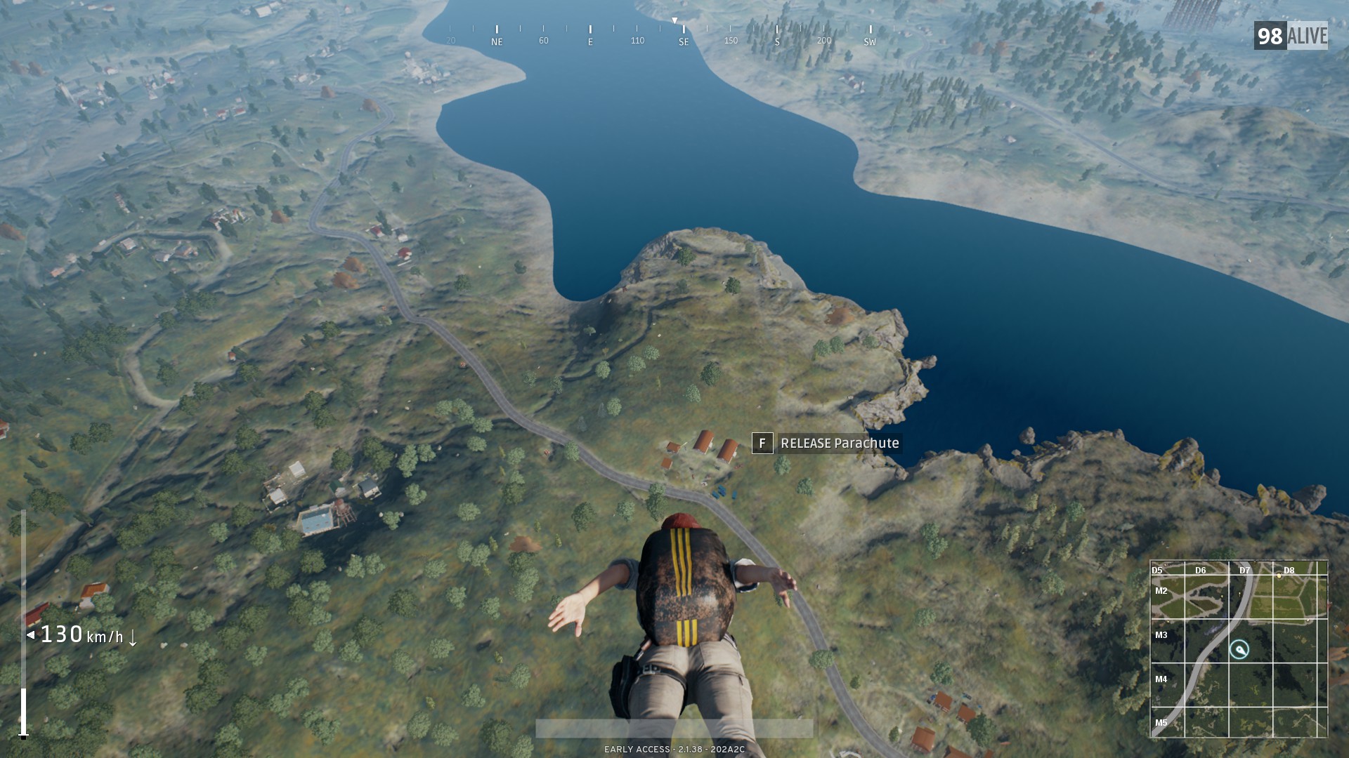 Screenshot of player landing after jumping from plane at the start of a PUBG match.