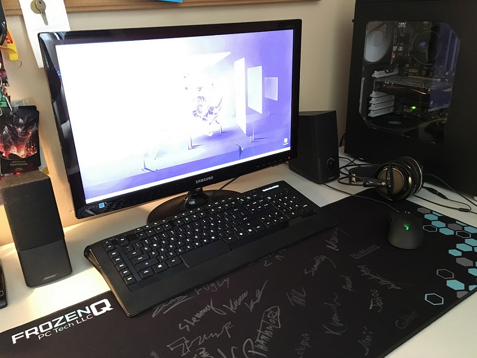 A photo of Patrick Valoppi's gaming setup, including a mousepad signed by esports pros.